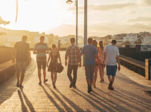 people walking on brown sand during daytime