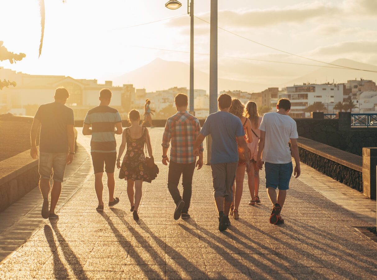 people walking on brown sand during daytime