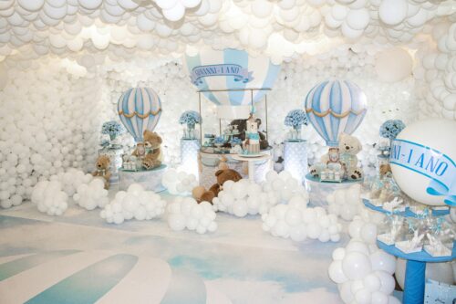 A playful teddy bear themed birthday setting with balloons and pastel colors, perfect for children's parties.