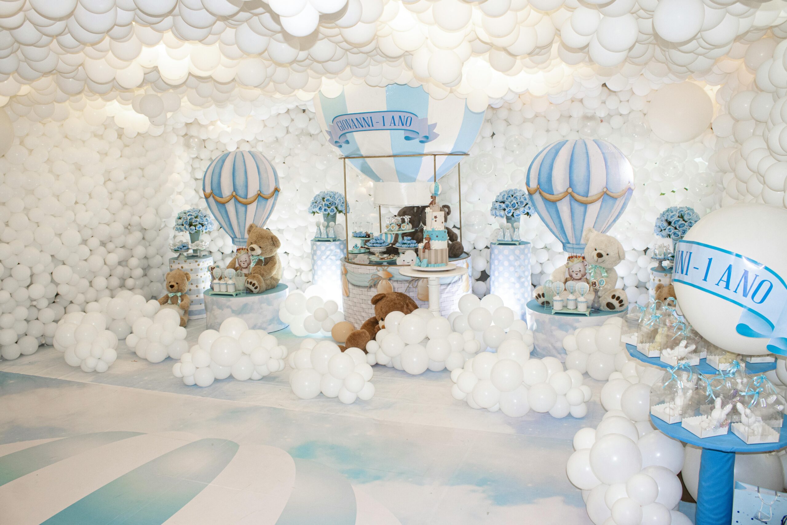 A playful teddy bear themed birthday setting with balloons and pastel colors, perfect for children's parties.